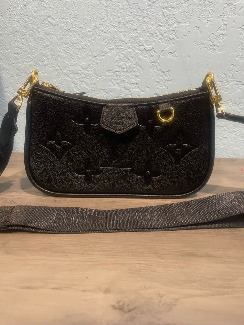 Black Embossed Monogram Crossbody Bag with Gold-Like Hardware